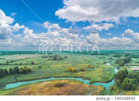 The winding brook flows across the field, view from above The winding brook flows across the field, view from above 140398691