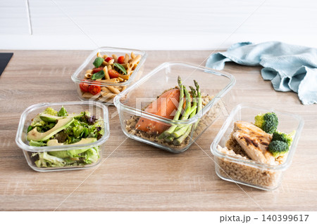 Healthy meal prep containers with salmon, chicken, pasta and fresh vegetables Healthy meal prep containers with salmon, chicken, pasta and fresh vegetables 140399617