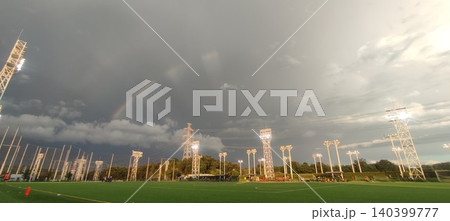 雨上がりの空に架かる虹と光の競技場 Rainbow and Light Over the Field 雨上がりの空に架かる虹と光の競技場 Rainbow and Light Over the Field 140399777