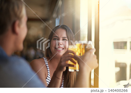 Toast, happy couple and drink beer in pub at party for celebration, relax and leisure together in restaurant. Smile, man and woman cheers with alcohol, beverage or glass at bar on a date at club Toast, happy couple and drink beer in pub at party for celebration, relax and leisure together in restaurant. Smile, man and woman cheers with alcohol, beverage or glass at bar on a date at club 140400266