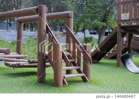 Outdoor kids playground made of natural logs with stairs and bridges. Kyrgyzstan Issyk-Ata June 10, 2026 Outdoor kids playground made of natural logs with stairs and bridges. Kyrgyzstan Issyk-Ata June 10, 2026 140400487