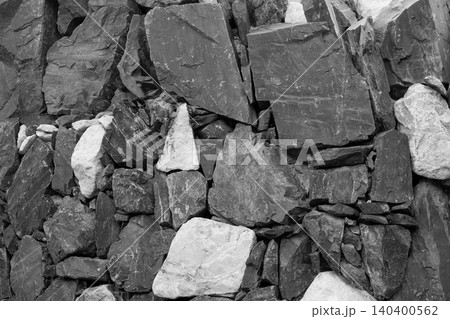 Ancient masonry wall built with natural gray river stones Ancient masonry wall built with natural gray river stones 140400562