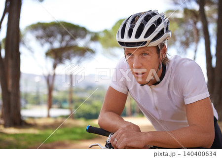 Face, thinking and breathing with man cycling in forest for exercise, fitness or off road sports hobby. Bike, helmet for training and tired young athlete with fatigue outdoor in woods for break Face, thinking and breathing with man cycling in forest for exercise, fitness or off road sports hobby. Bike, helmet for training and tired young athlete with fatigue outdoor in woods for break 140400634