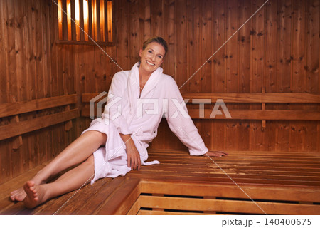 Woman, portrait and relax in sauna at hotel spa on vacation or beauty treatment or resting, detox or holiday. Female person, face and bathrobe for peace at Bali resort or leisure, stress free or calm Woman, portrait and relax in sauna at hotel spa on vacation or beauty treatment or resting, detox or holiday. Female person, face and bathrobe for peace at Bali resort or leisure, stress free or calm 140400675