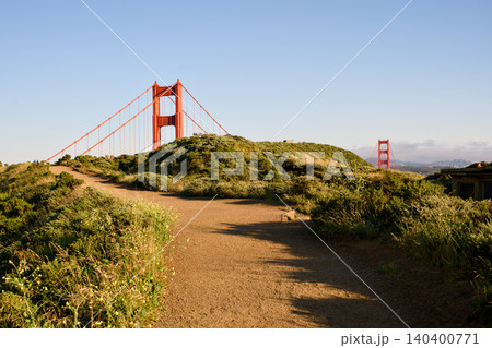 Marin Headlands trail leading toward Golden Gate Bridge towers Marin Headlands trail leading toward Golden Gate Bridge towers 140400771