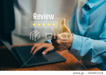 Positive Review and Thumbs Up Gesture for Feedback and Product Satisfaction on Laptop, Business concept. Positive Review and Thumbs Up Gesture for Feedback and Product Satisfaction on Laptop, Business concept. 140401316