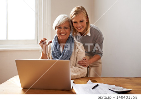 Woman, senior mother and laptop for finance in home, support and help for ecommerce on website. Daughter, old person and paperwork for tax return, investment and teaching on tech for online banking 140401558