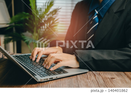 Business Professional Working on Laptop in Modern Office Environment with Natural Light, Business concept Business Professional Working on Laptop in Modern Office Environment with Natural Light, Business concept 140401862
