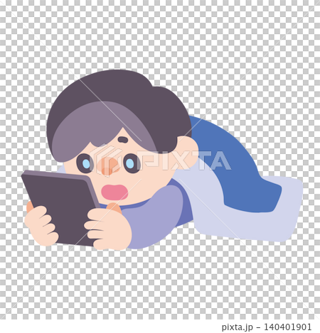 A boy using a tablet while lying down A boy using a tablet while lying down 140401901