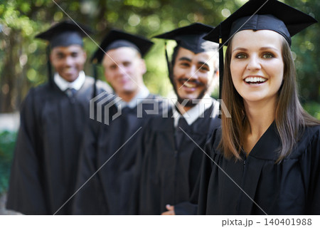 Graduation, classmates and woman for portrait, ceremony and students for education and college for campus. Outdoor, degree and celebration for university, friends and together with cap and gown Graduation, classmates and woman for portrait, ceremony and students for education and college for campus. Outdoor, degree and celebration for university, friends and together with cap and gown 140401988