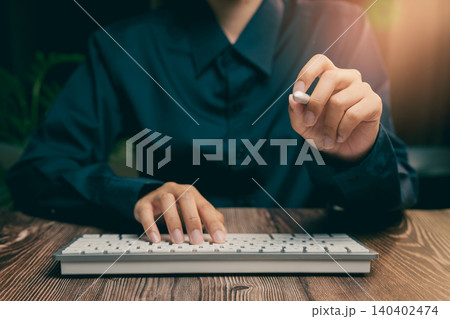 Focused Business Professional Using Keyboard with a Stylus in Modern Workspace Environment, Business concept 140402474