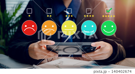 Customer satisfaction feedback, user rating experience on mobile smartphone with emoji icons and star review scale, service quality evaluation and user experience concept Customer satisfaction feedback, user rating experience on mobile smartphone with emoji icons and star review scale, service quality evaluation and user experience concept 140402674
