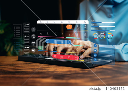 Digital Calendar Interface with Performance Metrics Displayed on Hands Typing at Laptop Desk, Business concept Digital Calendar Interface with Performance Metrics Displayed on Hands Typing at Laptop Desk, Business concept 140403151
