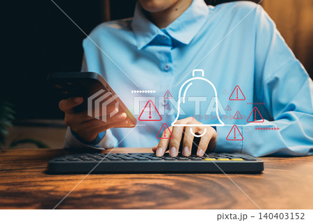 Person Using Smartphone and Typing on Computer with Notification Icons in Modern Office Environment, Business concept Person Using Smartphone and Typing on Computer with Notification Icons in Modern Office Environment, Business concept 140403152