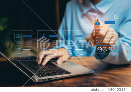 Professional Person Analyzing Digital Resumes with Modern Laptop and Graphic Visualization of Job Applications, Business concept 140403154