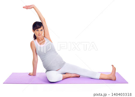 Portrait, fitness and yoga with pregnant woman on mat in studio isolated on white background for health. Exercise, pilates and stretching to warm up with young person training for pregnancy workout Portrait, fitness and yoga with pregnant woman on mat in studio isolated on white background for health. Exercise, pilates and stretching to warm up with young person training for pregnancy workout 140403318