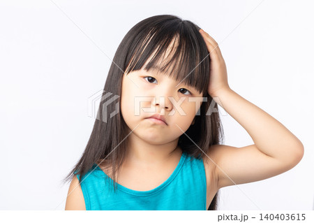 Frustrated Asian girl holding her head, feeling bored, tired or having a headache. Frustrated Asian girl holding her head, feeling bored, tired or having a headache. 140403615