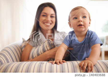 Mother, baby and love in portrait on couch, care and support or smile in living room and comfortable. Mommy, son and trust for bonding in childhood, single parent and happy for childcare on weekend 140403686