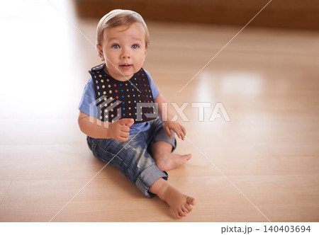 Boy, baby and relax in home on floor, growth and curious or relax in living room and care. Child development, happy kid and calm or comfortable, mockup space and toddler for health and wellness 140403694