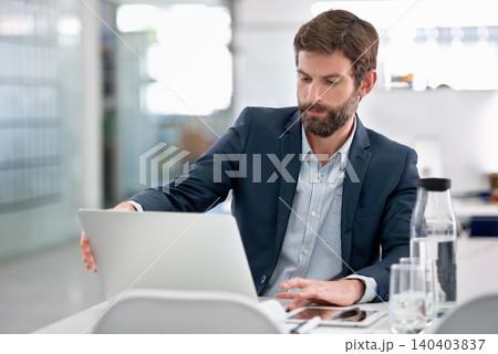 Laptop, reading and businessman in office for research on company finance or budget project. Technology, career and male financial advisor working with computer on corporate account in workplace. Laptop, reading and businessman in office for research on company finance or budget project. Technology, career and male financial advisor working with computer on corporate account in workplace. 140403837