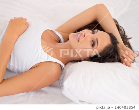 Portrait, woman and smile in bed for rest, break and waking up in bedroom at home, house or apartment. Female person, model and laying to relax on vacation, weekend and happy after beauty sleep Portrait, woman and smile in bed for rest, break and waking up in bedroom at home, house or apartment. Female person, model and laying to relax on vacation, weekend and happy after beauty sleep 140403854