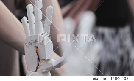 Robotic prosthetic hand prototype. Close up of a 3D printed bionic arm with visible wiring 140404083