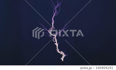 High voltage electricity discharging from a Tesla coil against a dark background High voltage electricity discharging from a Tesla coil against a dark background 140404291