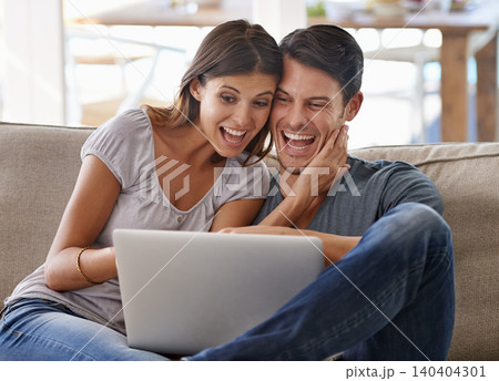 Happy couple, laptop and sofa with good news for winning, giveaway or surprise in living room at home. Excited man and woman with smile on computer in celebration for promo, deal or discount at house Happy couple, laptop and sofa with good news for winning, giveaway or surprise in living room at home. Excited man and woman with smile on computer in celebration for promo, deal or discount at house 140404301