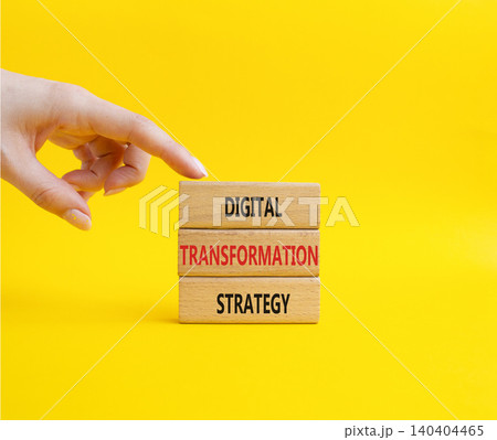 Digital Transformation Strategy symbol. Concept word Digital Transformation Strategy on wooden blocks. Businessman hand. Beautiful yellow background. Business and Digital Transformation Strategy. Copy Digital Transformation Strategy symbol. Concept word Digital Transformation Strategy on wooden blocks. Businessman hand. Beautiful yellow background. Business and Digital Transformation Strategy. Copy 140404465