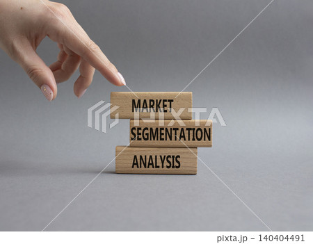 Market Segmentation Analysis symbol. Concept word Market Segmentation Analysis on wooden blocks. Businessman hand. Beautiful grey background. Business and Market Segmentation Analysis. Copy space 140404491