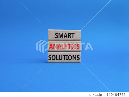 Smart Analytics Solutions symbol. Concept word Smart Analytics Solutions on wooden blocks. Beautiful blue background. Business and Smart Analytics Solutions. Copy space 140404783