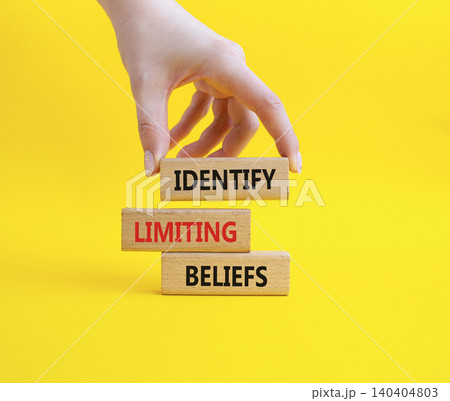 Limiting Beliefs symbol. Concept word Identify Limiting Beliefs on wooden blocks. Businessman hand. Beautiful yellow background. Business and Limiting Beliefs concept. Copy space Limiting Beliefs symbol. Concept word Identify Limiting Beliefs on wooden blocks. Businessman hand. Beautiful yellow background. Business and Limiting Beliefs concept. Copy space 140404803