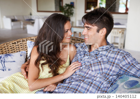 Couple, relax and romantic on couch for love, relationship and spouse comfort for security. Man, woman and together in living room for bonding, commitment and summer vacation for happiness and safety 140405112
