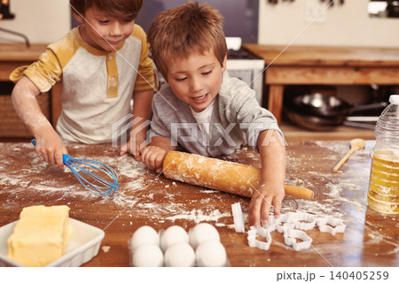 Children, baking and playing in kitchen with ingredients for dessert cake, cookies and fun. Cooking, mess and young brother siblings bonding together for happiness, utensils and smile in house. 140405259