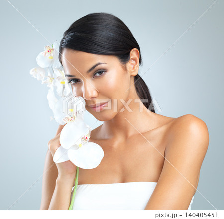 Portrait, woman or flower for natural, skincare or dermatology in studio on white background. Plant, female person or flawless skin for gentle, organic or treatment for facial, hydration or glow 140405451