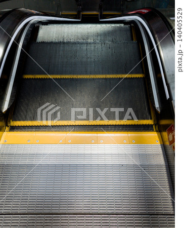 escalator with yellow safety edges escalator with yellow safety edges 140405529
