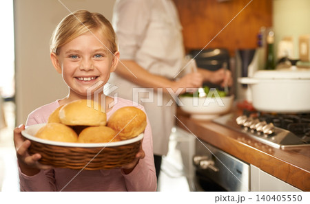Portrait, young girl and cooking with mother, kitchen and bread basket for family dinner. Smile, proud and development of food education, preparation and nutrition or bonding with mom at home 140405550