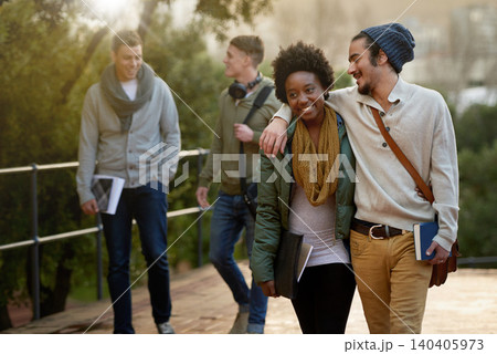 Interracial, couple and college student with hug in outdoor, campus and happy with love, support and care. University, education and texbook with notes for research to study for exams and assessment Interracial, couple and college student with hug in outdoor, campus and happy with love, support and care. University, education and texbook with notes for research to study for exams and assessment 140405973