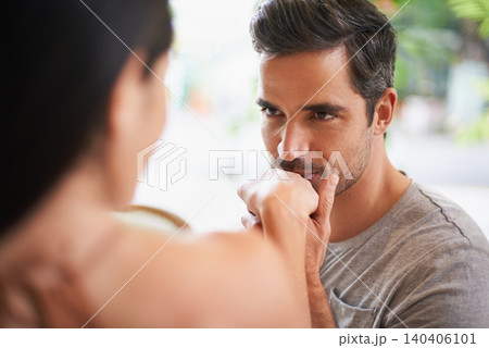 Hand, kiss or couple on date at restaurant for marriage commitment, anniversary or celebration. Romantic man, woman or honeymoon in Italy or relationship with love, connection or bonding together 140406101