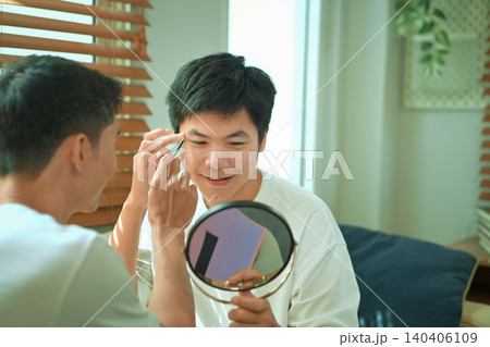 Photo set of LGBTQ applying glitter makeup with partner Photo set of LGBTQ applying glitter makeup with partner 140406109