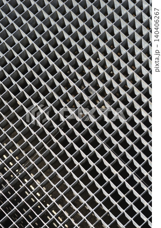 Industrial metal drainage grate with a square grid pattern Industrial metal drainage grate with a square grid pattern 140406267