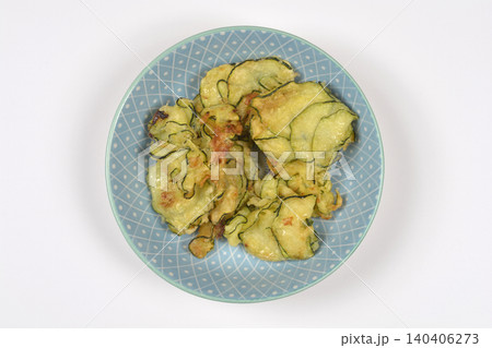 Top down view of fried zucchini fritters on a plate 140406273