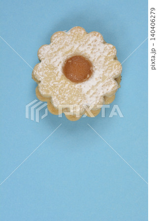 Linzer cookie with jam on blue background Linzer cookie with jam on blue background 140406279