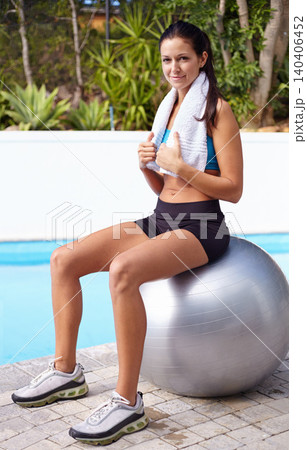 Portrait, fitness and happy woman on pilates ball outdoor at swimming pool for workout, training or sports. Exercise, towel and person with healthy body, wellness and summer by water in Australia Portrait, fitness and happy woman on pilates ball outdoor at swimming pool for workout, training or sports. Exercise, towel and person with healthy body, wellness and summer by water in Australia 140406452