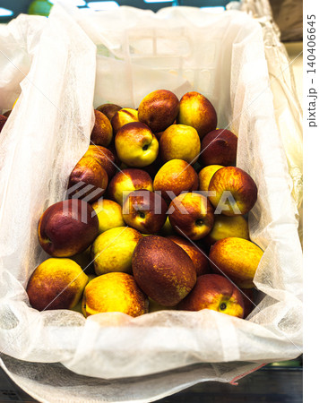 Freshly harvested juicy nectarines in a market display basket Freshly harvested juicy nectarines in a market display basket 140406645