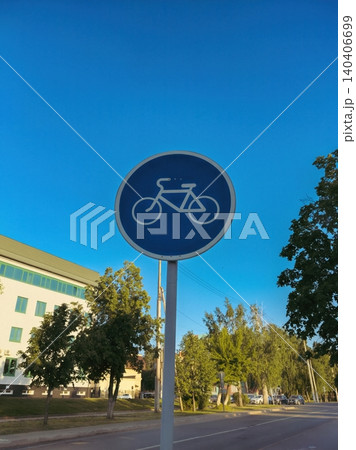 Bicycle lane sign against clear blue sky in urban setting Bicycle lane sign against clear blue sky in urban setting 140406699