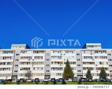 Urban apartment building with blue sky in a modern residential neighborhood Urban apartment building with blue sky in a modern residential neighborhood 140406717
