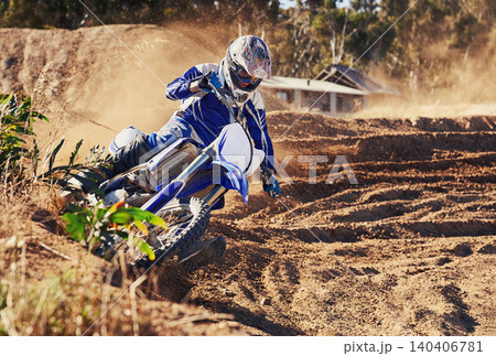 Person, dirt bike and professional motorcyclist in extreme sports, competition or race on outdoor track. Expert rider on motorbike or scrambler for sand course, challenge or off road rally in nature 140406781