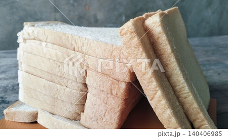 Sliced white bread on a rustic wooden table background Sliced white bread on a rustic wooden table background 140406985