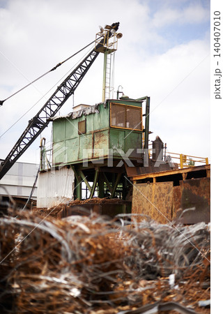 Crane, machine and scrapyard for moving metal with sustainability, manufacturing or stop pollution. Vehicle, tractor and outdoor in junkyard, plant or ecology for iron, steel industry and environment Crane, machine and scrapyard for moving metal with sustainability, manufacturing or stop pollution. Vehicle, tractor and outdoor in junkyard, plant or ecology for iron, steel industry and environment 140407010